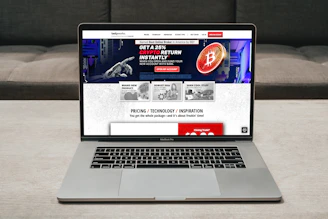 a laptop computer sitting on top of a table