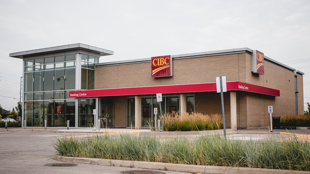 a fast food restaurant with a red awning