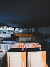 boxes are stacked on top of each other in a warehouse