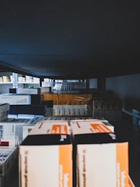 boxes are stacked on top of each other in a warehouse