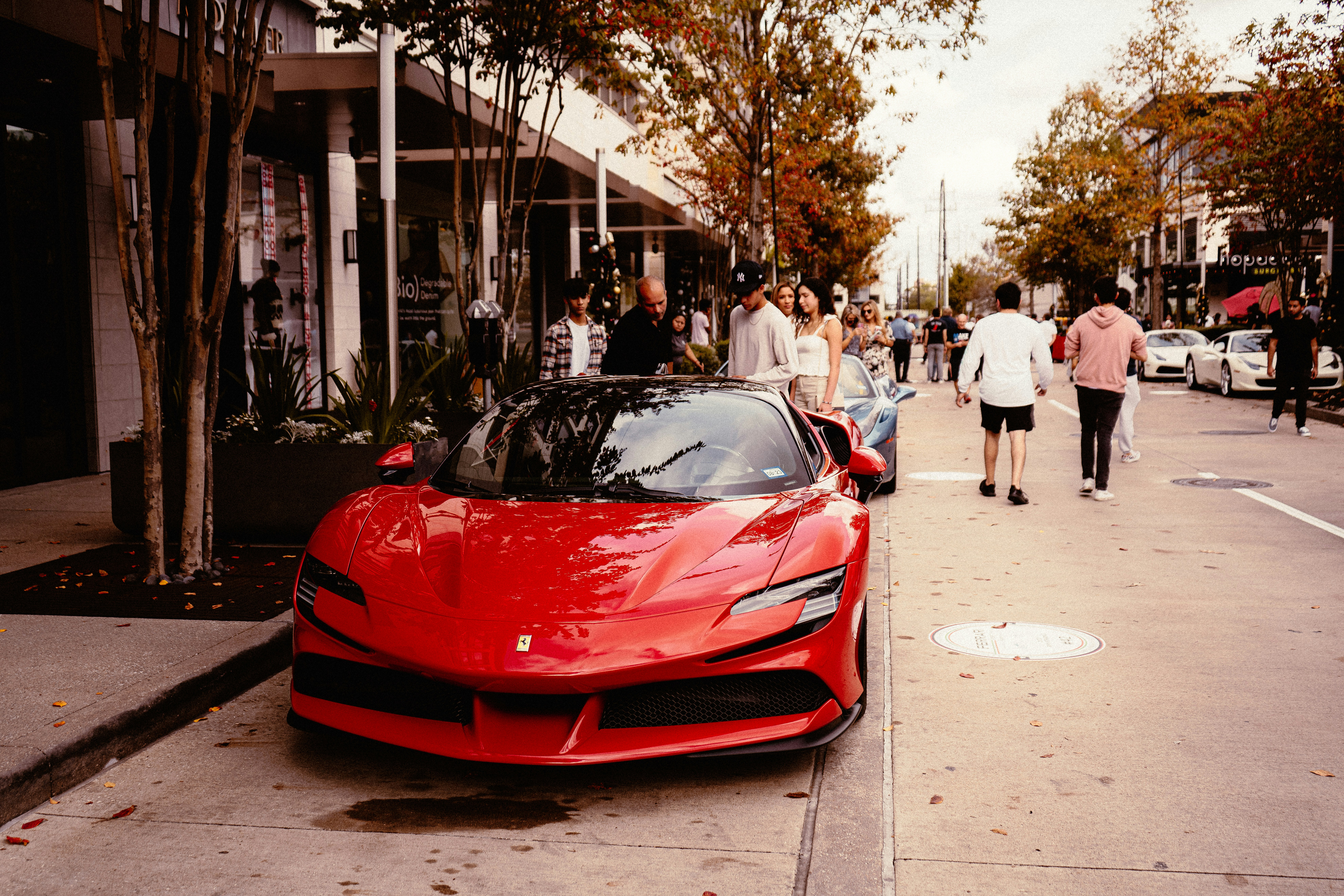 a red sports car parked on the side of the road