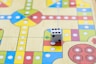 a close up of a board game with dices