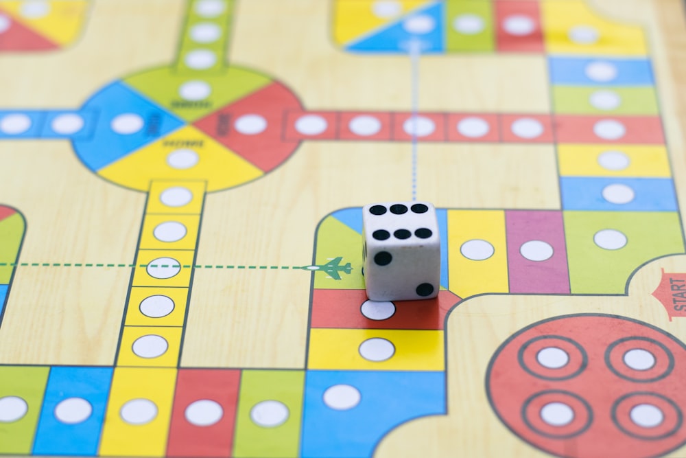 a close up of a board game with dices