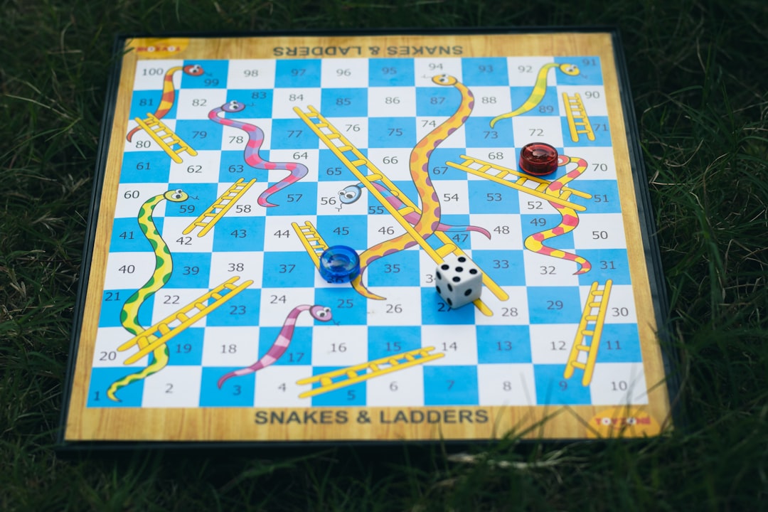 a game of snakes and ladders on the grass