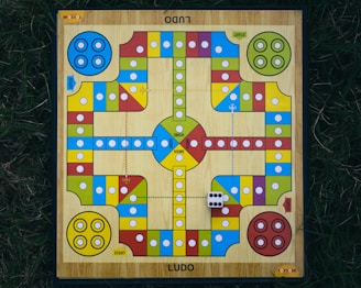 a wooden board game on the grass