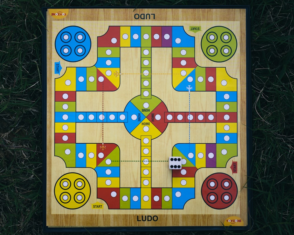 a wooden board game on the grass