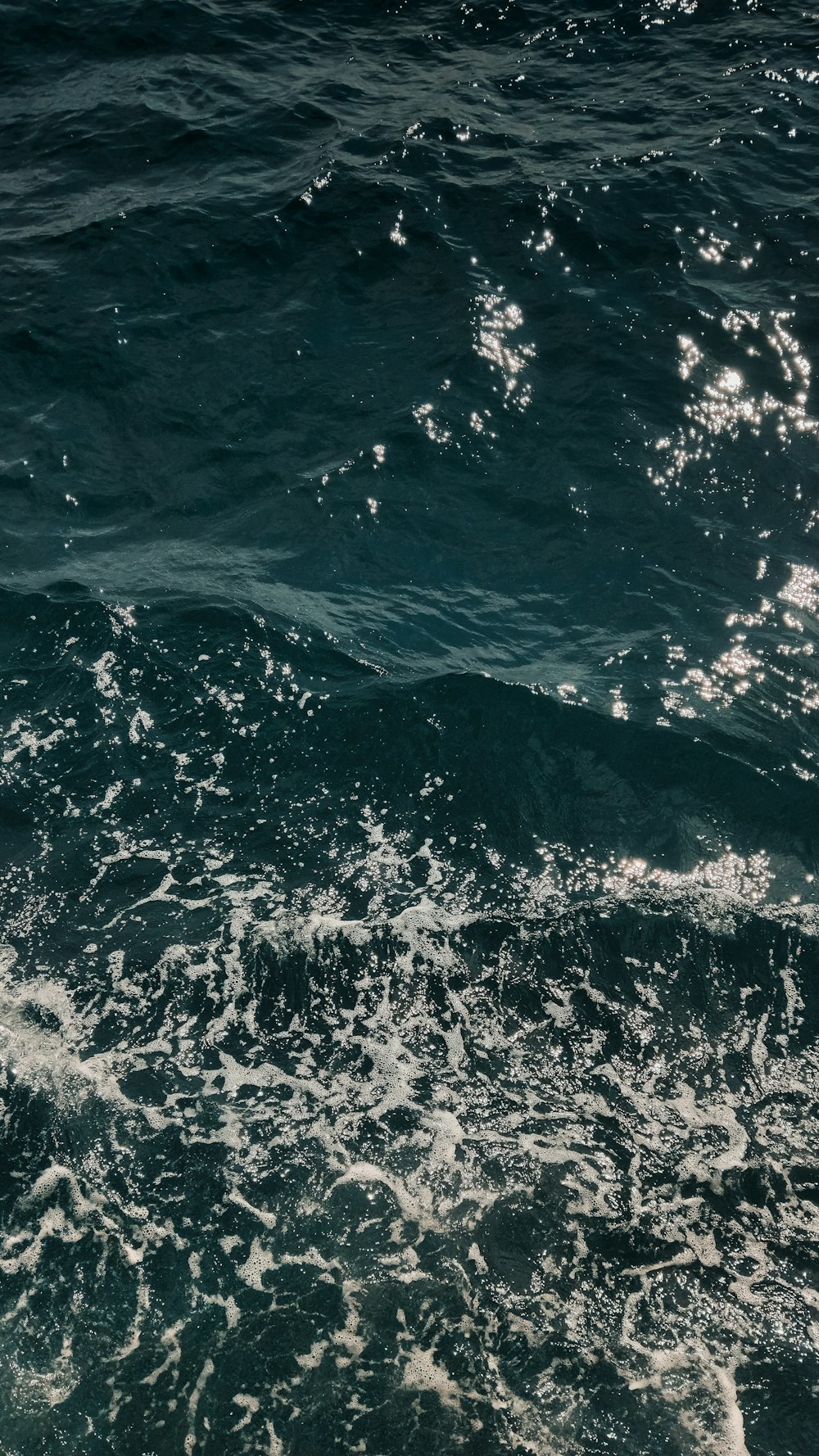 a person riding a surfboard on top of a body of water