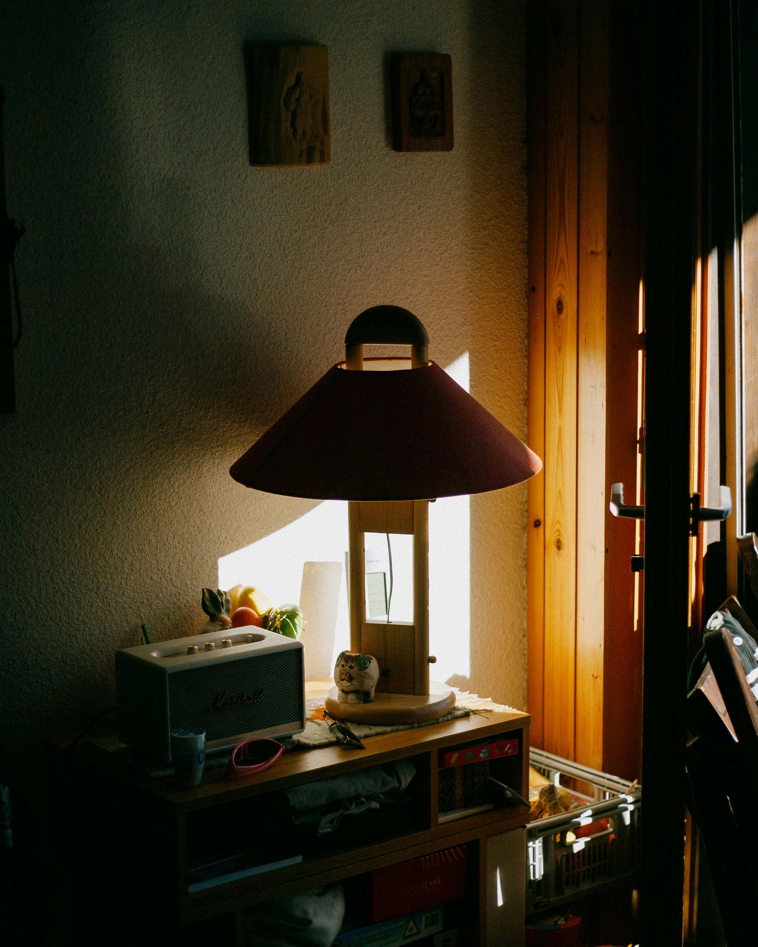 a lamp sitting on top of a wooden table