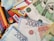 A scattered arrangement of various banknotes and credit cards, including Visa and Mastercard. The banknotes are in denominations of 1000, 2000, and 5000, featuring different colors and designs.