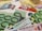 A close-up of various euro banknotes and credit cards arranged together. The focus is on the 100 euro bills, with multiple denominations of euro bills and several credit cards, including VISA and Mastercard, scattered in the background.