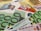 A close-up of various euro banknotes and credit cards arranged together. The focus is on the 100 euro bills, with multiple denominations of euro bills and several credit cards, including VISA and Mastercard, scattered in the background.