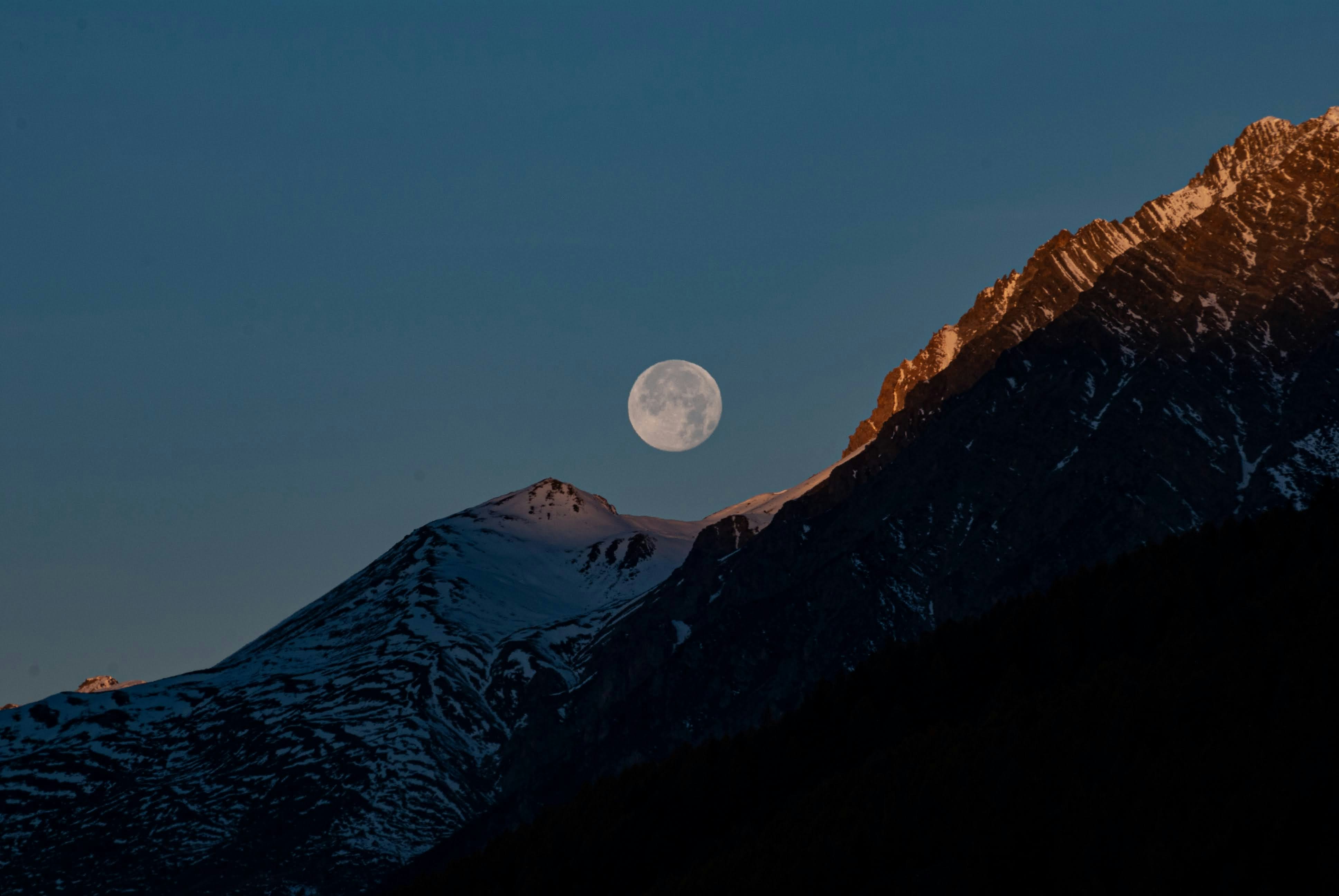 a full moon rising over a mountain range, Moon on Alps (Valtellina)