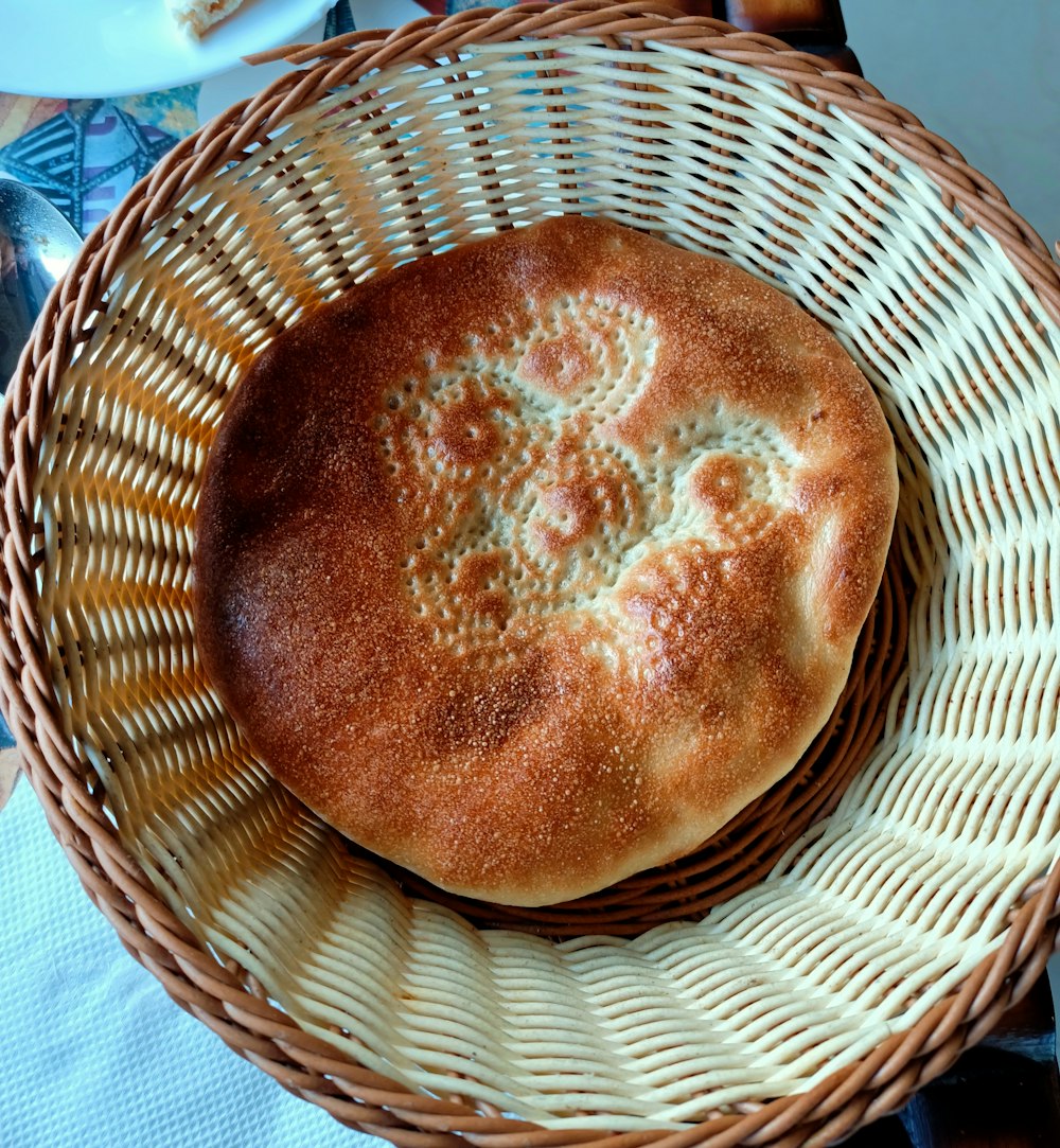 a close up of a bread in a basket on a table