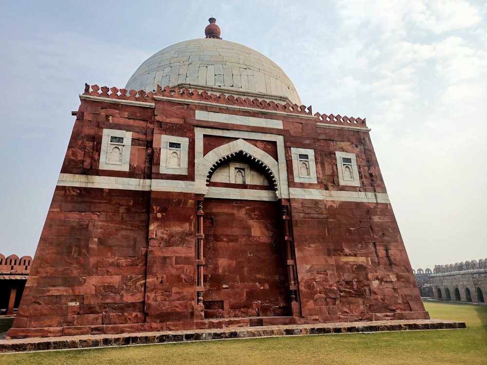 a large brick building with a dome on top