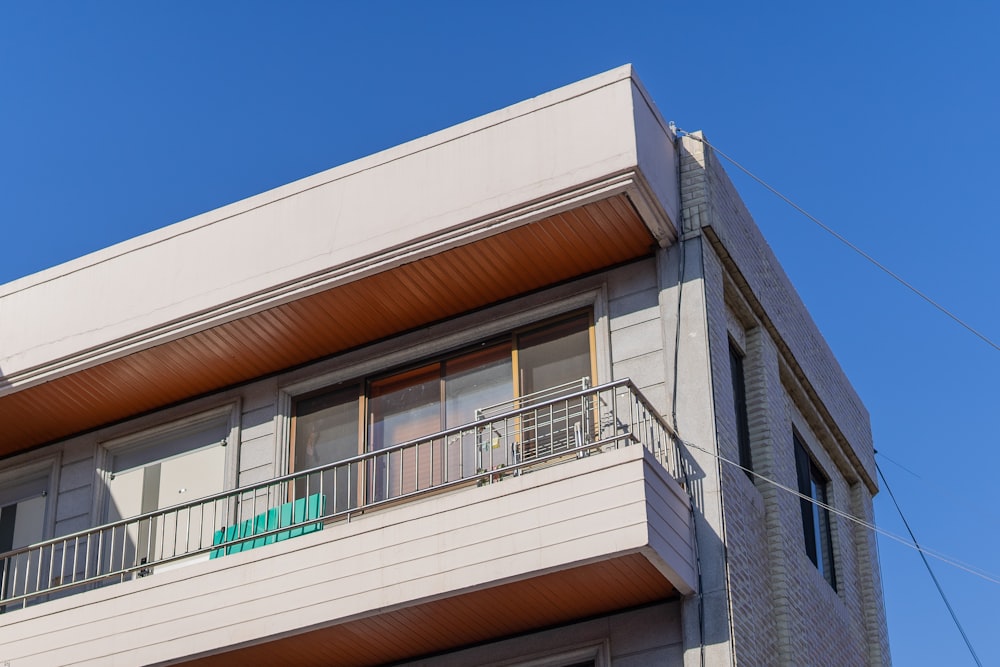 an apartment building with a balcony and balconies