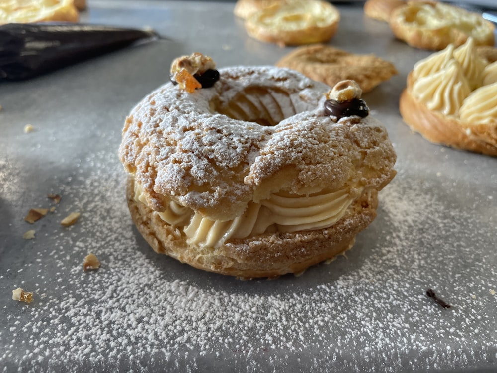 a powdered doughnut with a bite taken out of it