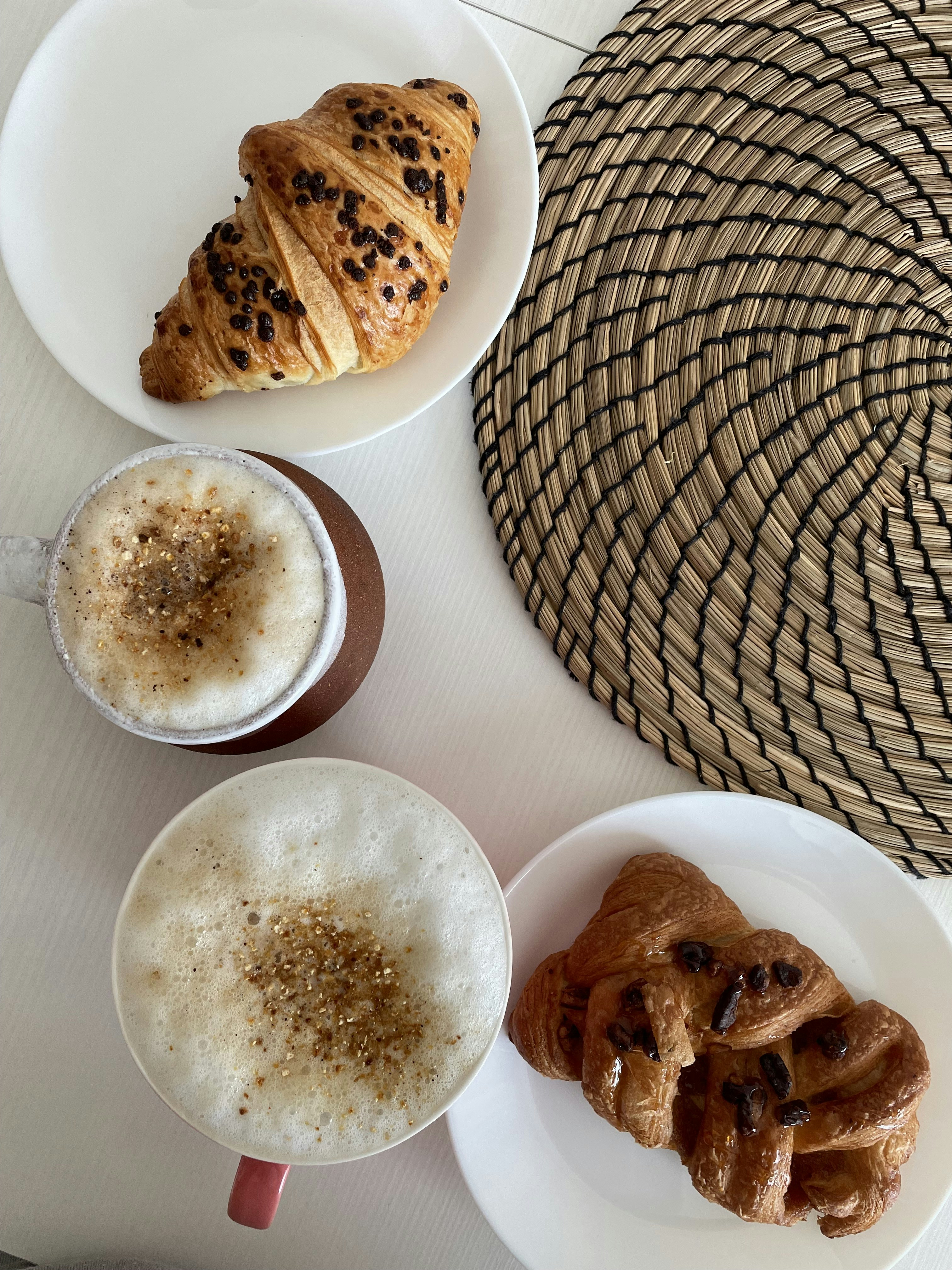 a table topped with plates of food and drinks