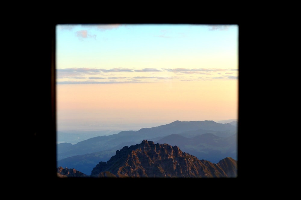 a view of a mountain range from the top of a mountain