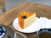 a piece of cake sitting on top of a white plate