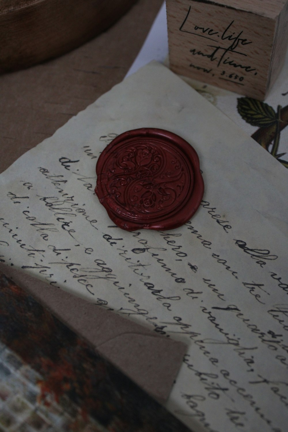 a wax stamp sitting on top of a piece of paper