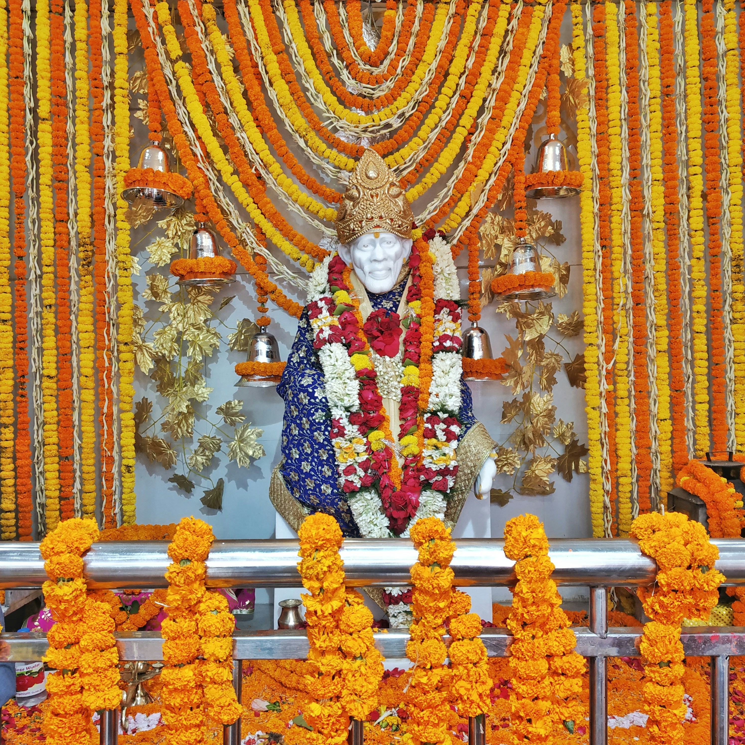 a statue of a person surrounded by flowers