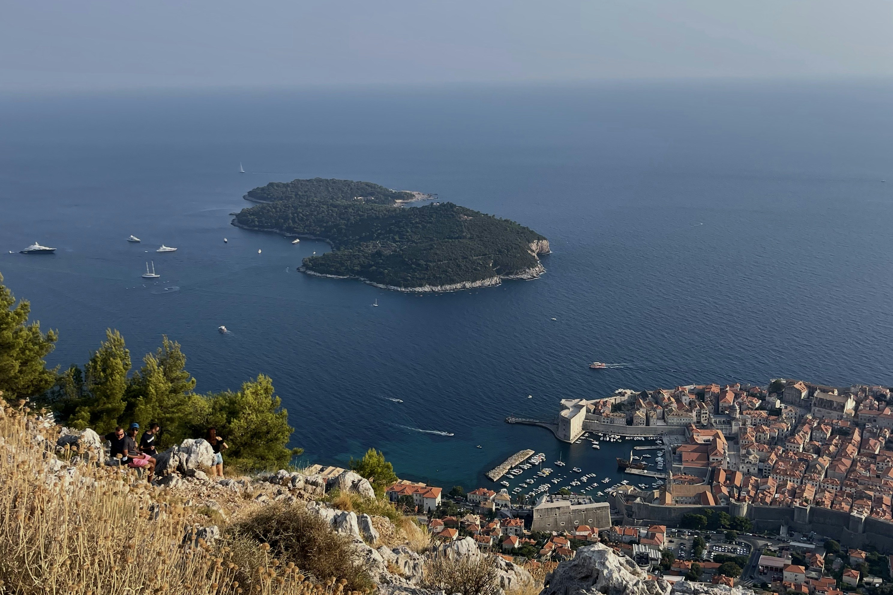 A small island in the middle of a large body of water