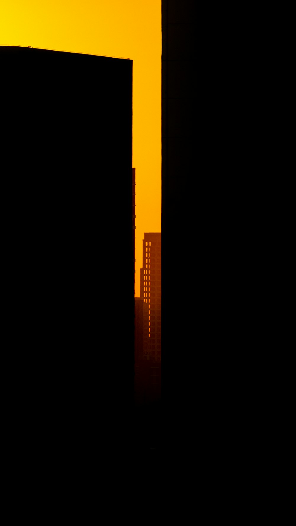 a black and yellow photo of a city skyline