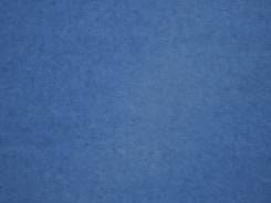an airplane is flying in the blue sky