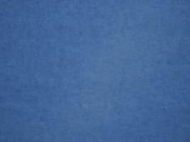 an airplane is flying in the blue sky