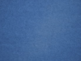 an airplane is flying in the blue sky