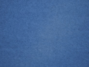 an airplane is flying in the blue sky
