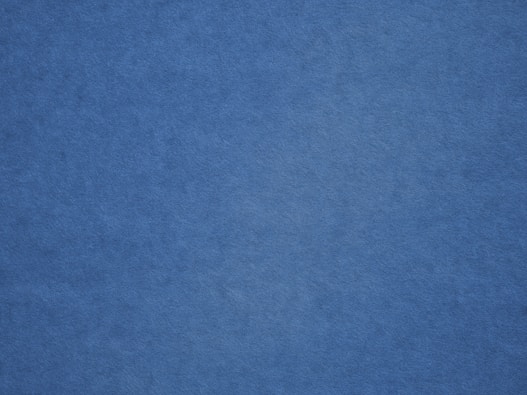 an airplane is flying in the blue sky