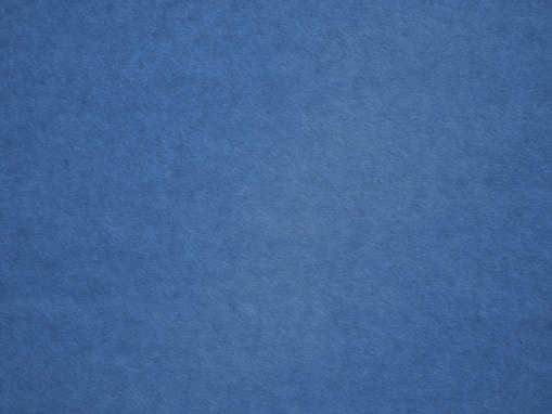 an airplane is flying in the blue sky