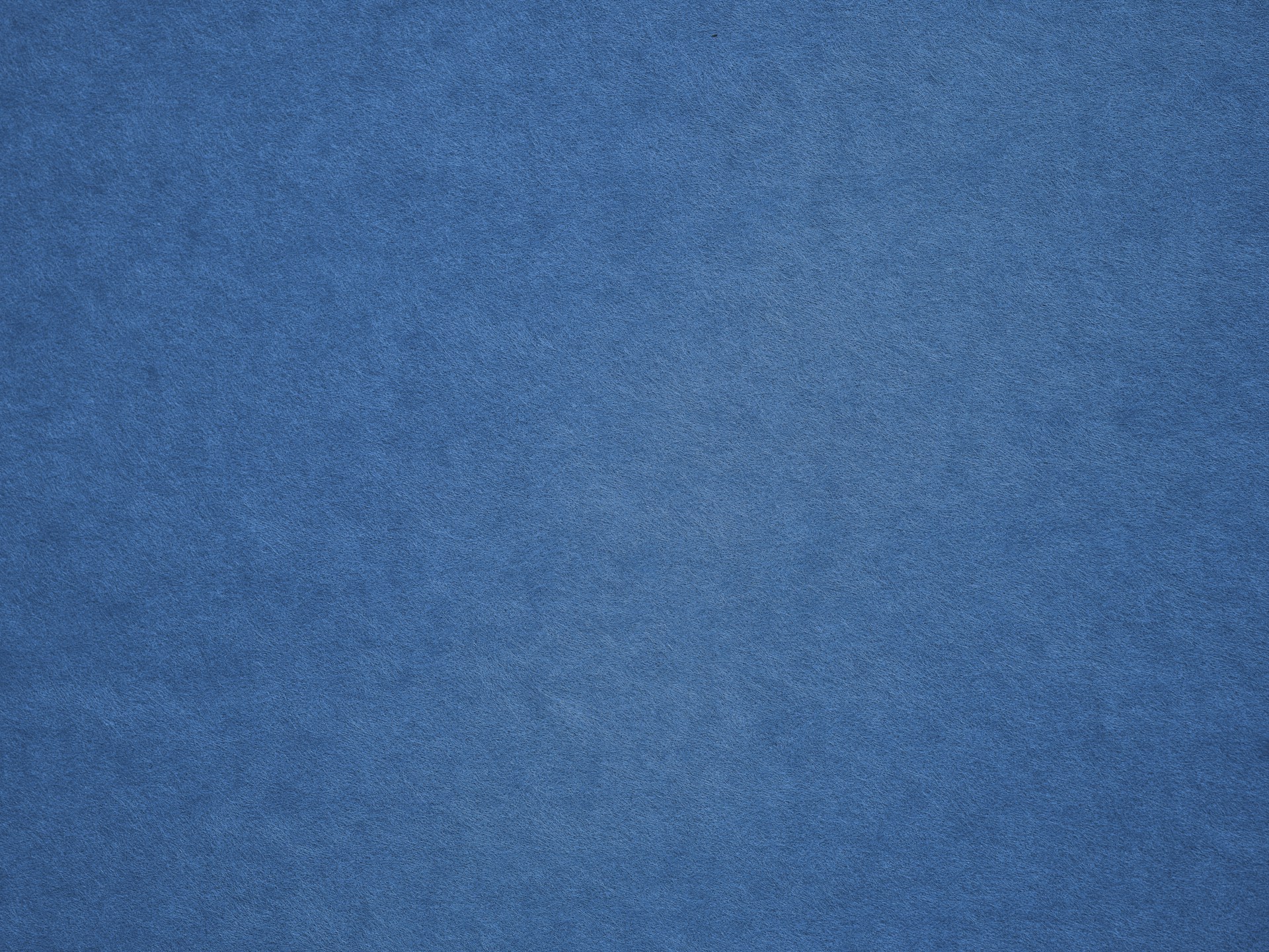 an airplane is flying in the blue sky