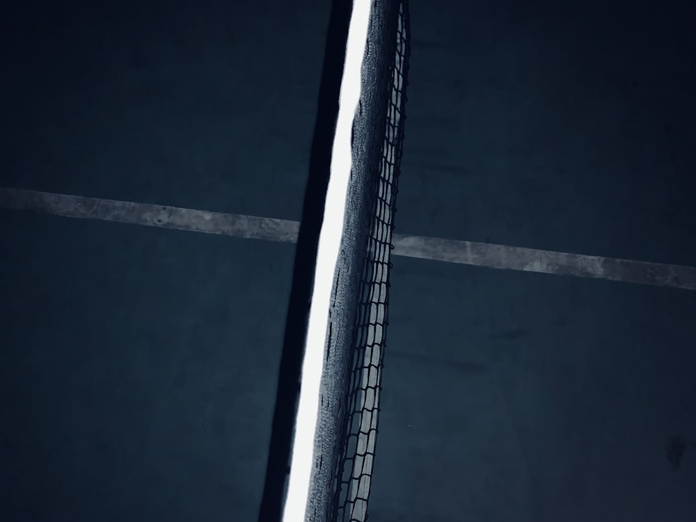 a black and white photo of a tennis racket