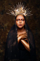 Artistic portrait of a model wearing fashion pieces inspired by Viking armor and Egyptian motifs.