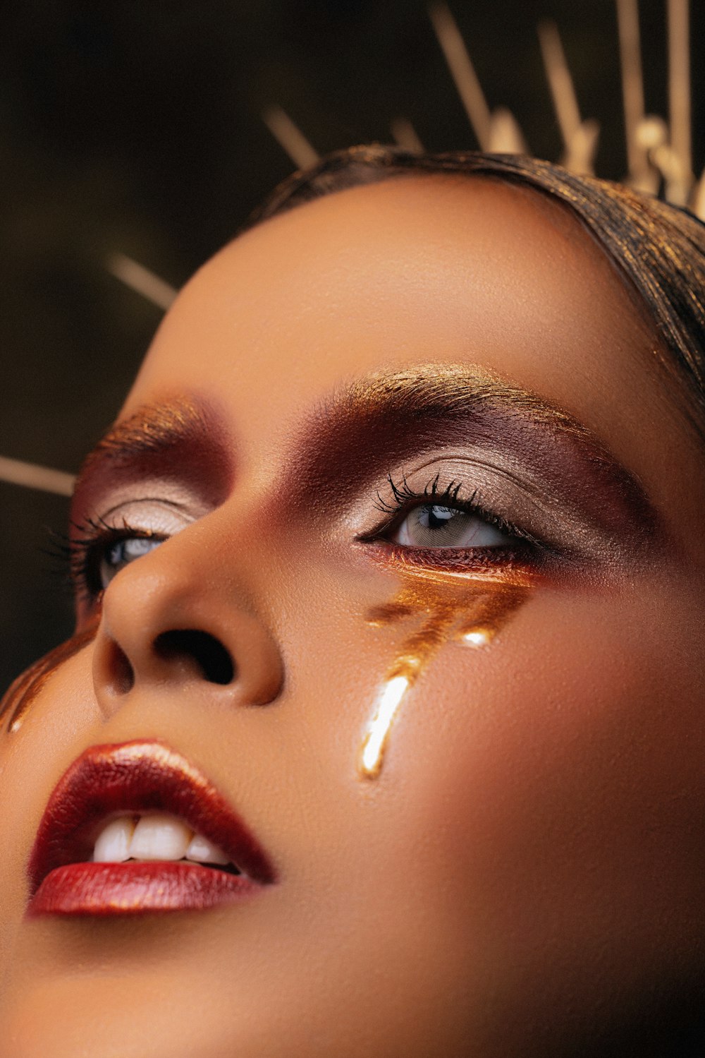 a close up of a woman with makeup on her face