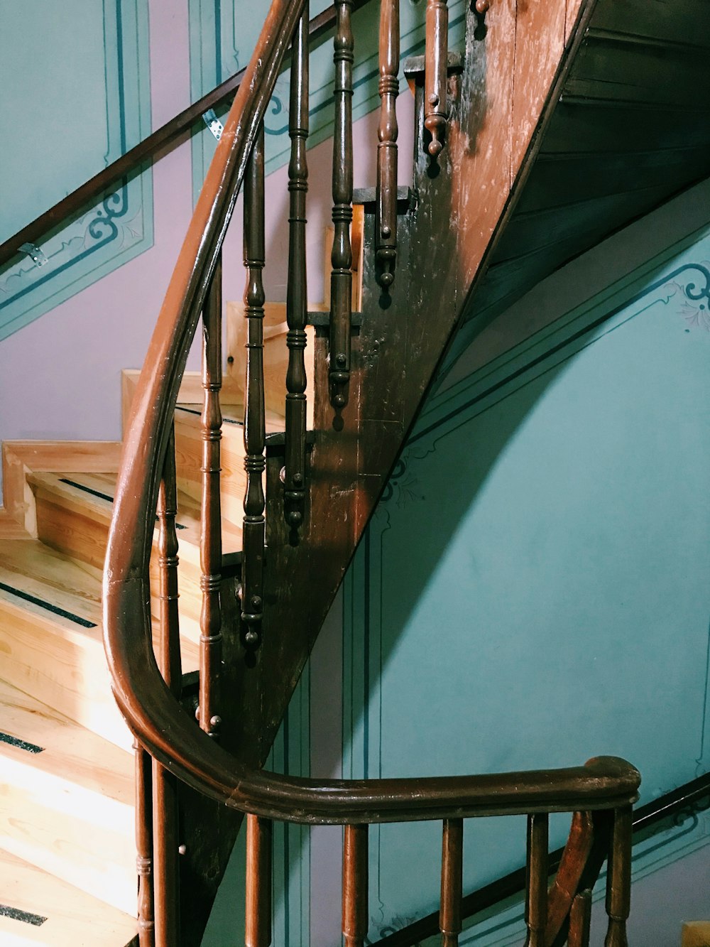 a set of stairs in a building with blue walls