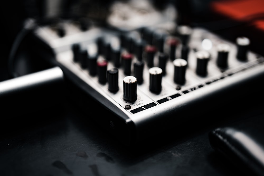 a close up of a sound mixing console