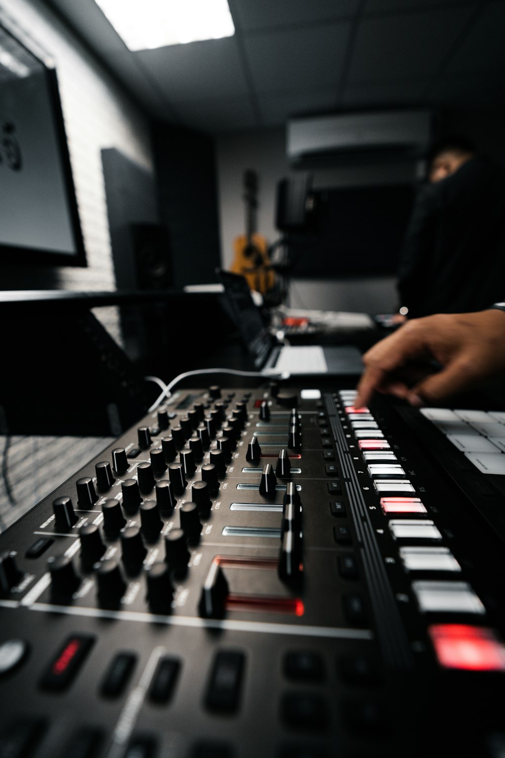 a dj mixing a track in a recording studio