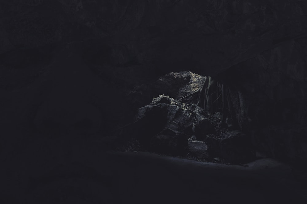 a dark cave filled with lots of rocks