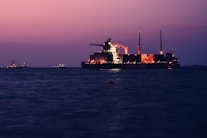 a large cargo ship in the middle of the ocean