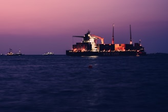 a large cargo ship in the middle of the ocean
