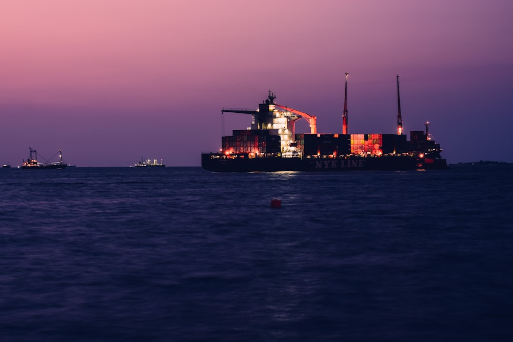 a large cargo ship in the middle of the ocean