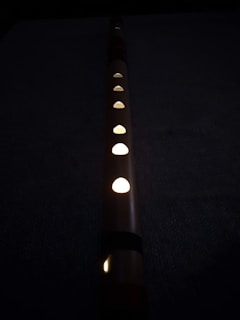 a row of lights sitting on top of a black surface