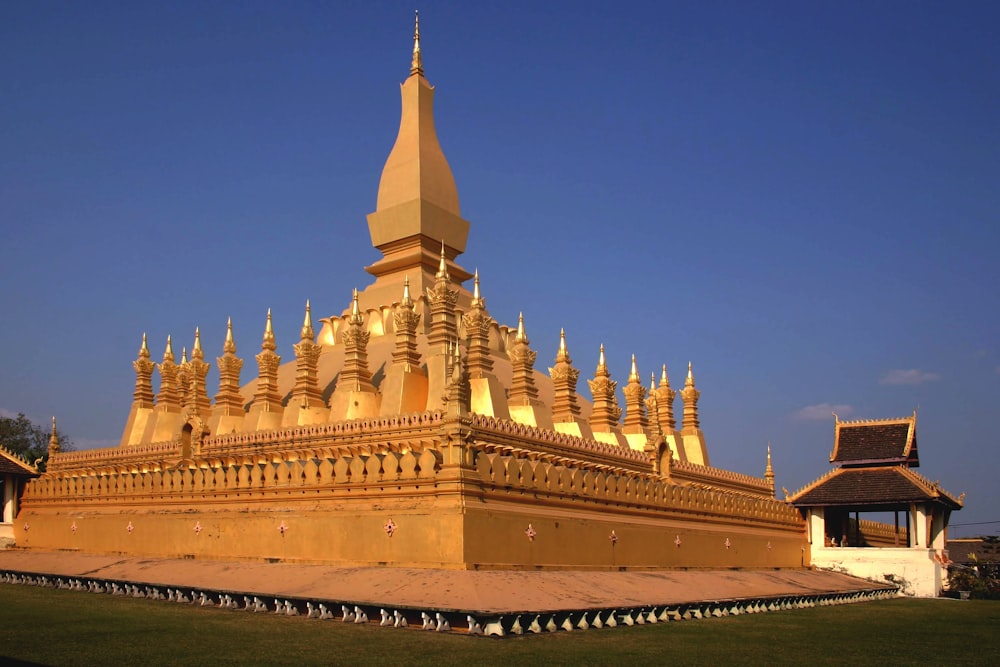 a large golden building with a sky background