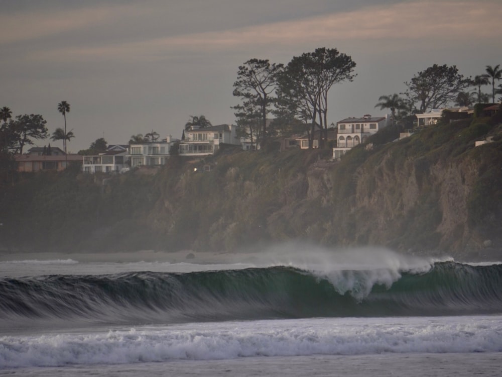 a person riding a surfboard on a wave in the ocean