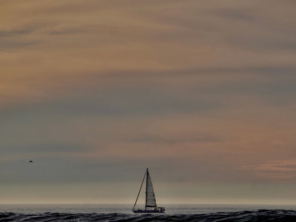 a sailboat in the middle of a large body of water