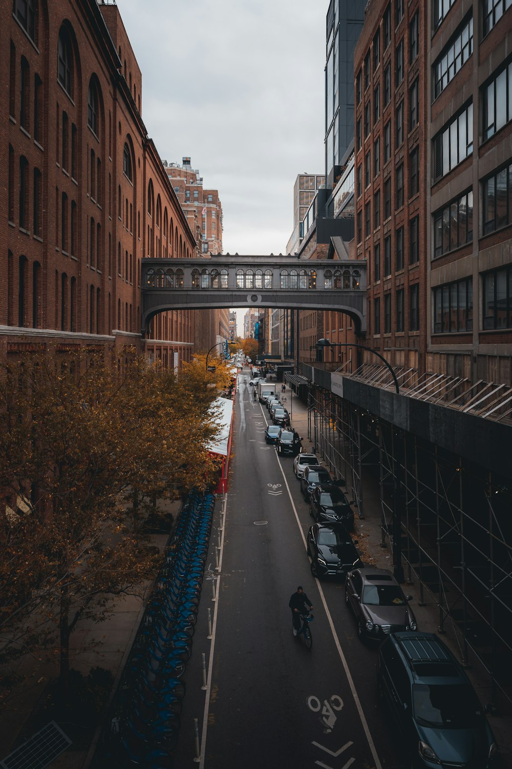 a city street with a bridge over it