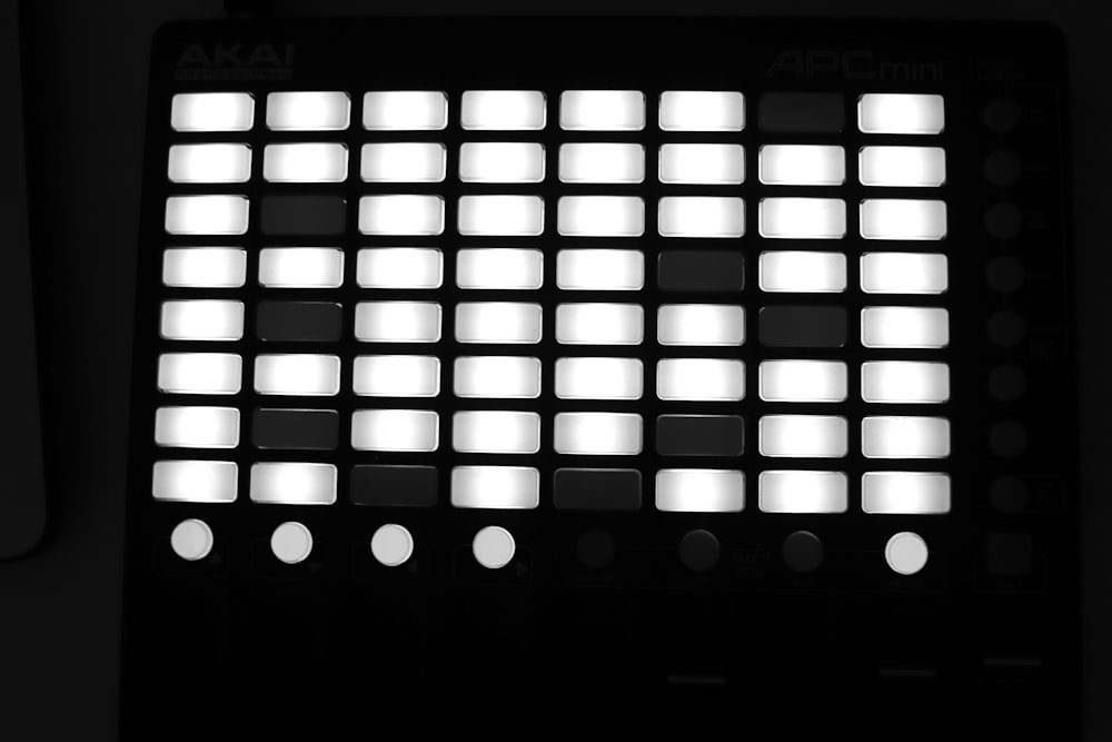 a black and white photo of a sound board